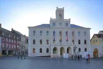 Historic neo-Gothic town hall with national flags, landmark, market square, Weimar, Thuringia,