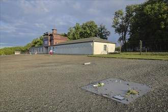 Concentration camp building with camp gate, gatehouse, memorial plaque, ground, Nazi era, beech