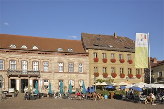 Market square with flag and street pub, Hammelburg, Lower Franconia, Franconia, Bavaria, Germany,