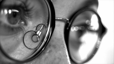 Close-up view of a person's eye with a monocle, captured in black and white, AI generated