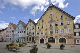 Historic half-timbered houses with town hall built in 1765 with murals and yellow guardhouse built