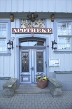 Door with decorations of the mountain pharmacy, house number, inscription, pharmacy, blue,