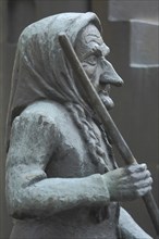 Sculpture Witch by Hubert Rieber 1985 with broomstick, striking large nose, face, detail, bronze,