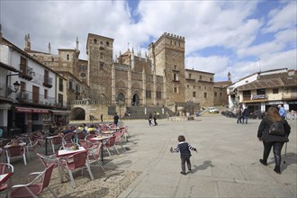 UNESCO Real Monasterio de Nuestra Senora, monastery complex, people, child, street pub, Guadalupe,