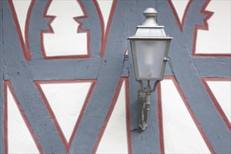 Street lamp on the wall of a half-timbered house, red, grey, frame, border, detail, decoration,