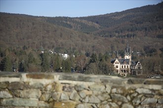 Townscape with Villa Andreae Castle and forest, stone wall, blurred, Königstein, Taunus, Hesse,