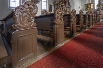 Pews with baroque cheeks in the parish church Mariae Heimsuchung 15th century, baroqueised in the