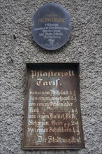 Historic tin sign on the house from 1497 of the last plaster customs station of Mainbernheim, Lower