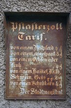 Historic tin sign on the house from 1497 of the last plaster customs station of Mainbernheim, Lower