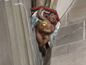 Devil with convex mirror, console stone in Heilig Kreuz Minster, Rottweil, Baden-Württemberg,