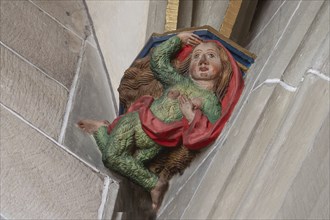 Wild woman with shaggy robe, console stone in Heilig Kreuz Minster, Rottweil, Baden-Württemberg,