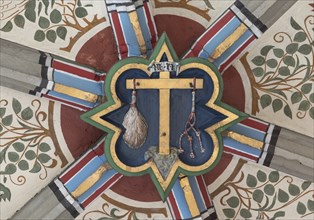 Cross of Jesus with the instruments of the scourge, keystone in the vault of the Cathedral of the