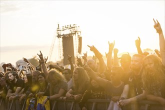 Festival-goers in the front row give the devil's salute at the Wacken Open Air in Wacken. The