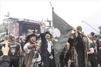 Festival visitors dressed as pirates at the Wacken Open Air in Wacken. The traditional metal