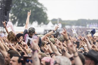 Crowdsurfer at the Wacken Open Air in Wacken. The traditional metal festival takes place from 31