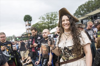 Festival visitor in medieval garb at the Wacken Open Air in Wacken. The traditional metal festival