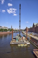 Crane on a pontoon in the inland harbour, construction site at the quay wall and Kehrwieder street,