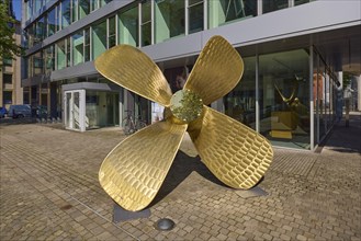 Brass ship's propeller as decoration in front of the Regus office space rental building, Free and