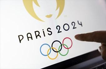 In this photo illustration, Paris 2024 olympic logo displayed on a smart phone