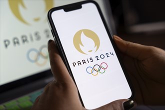 In this photo illustration, Paris 2024 olympic logo displayed on a smart phone