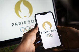 In this photo illustration, Paris 2024 olympic logo displayed on a smart phone