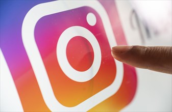 In this photo illustration, logo of social media application Instagram icon or logo displayed on a