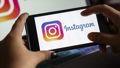 In this photo illustration, logo of social media application Instagram icon or logo displayed on a