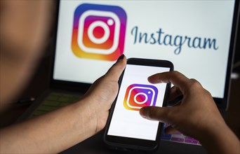 In this photo illustration, logo of social media application Instagram icon or logo displayed on a