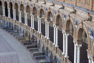 Colonnade and tiled benches of the pavilion at the Plaza de Espana in Seville, Andalusia, Spain,