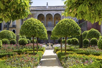 Garden with exotic plants, Casa de Pilatos city palace with Mudejar style elements, Seville,