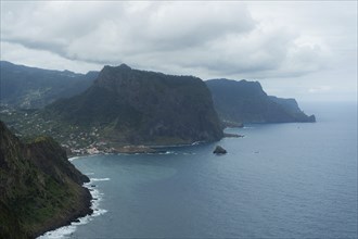 Penha d'Aguia Mountain on Cloudy Day and Ocean. Vereda do Larano. Madeira, Portugal, Europe