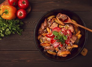 Ojakhuri, Traditional Georgian dish, fried potatoes with meat, in a clay frying pan, top view, no