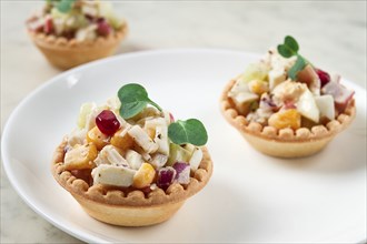 Canapes with salad, corn with crab sticks, appetizer, portioned, close-up, no people