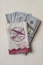 International passport, with dollars, bills inside, top view, no people