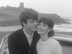 A serene black and white photograph of a smiling couple by the seaside, evoking a vintage and