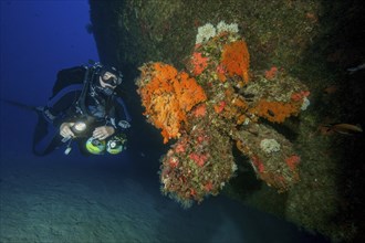 Diver with special equipment Stages additional diving cylinders for different gas mixtures