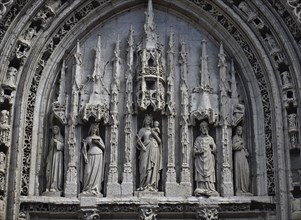 Tympanum at the Sainte Radegonde church (Poitiers, France) . Sainte Radegonde is 2th from left,