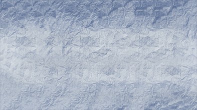 Crumpled paper with textured surface in varying blue tones creating an abstract pattern