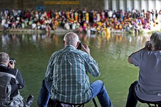 Photographing Hindus under the A2 motorway bridge during ritual purification, Datteln-Hamm Canal,