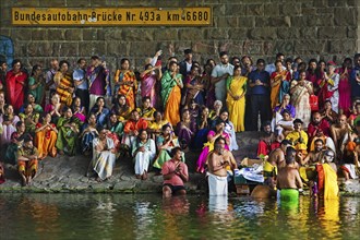 Hindus under the motorway bridge of the A2 at and in the Datteln-Hamm canal during ritual