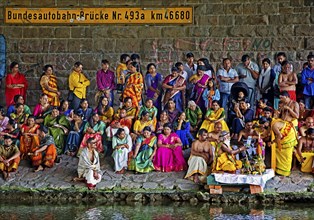 Hindus under the motorway bridge of the A2 at and in the Datteln-Hamm canal during ritual