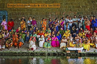 Hindus under the motorway bridge of the A2 at and in the Datteln-Hamm canal during ritual