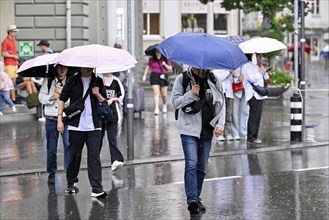 People with umbrellas