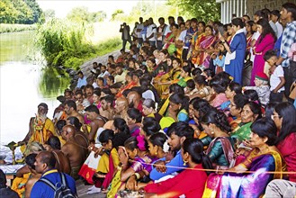 Hindus under the motorway bridge of the A2 at the Datteln-Hamm canal during ritual purification,