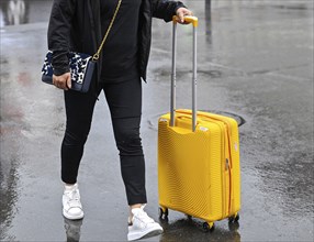 Woman with trolley case