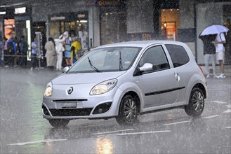 Small car in the rain