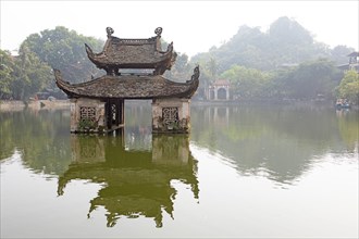 Pagoda on the panoramic lake of the Buddhist Thay Temple or Chua Thay or Master Temple, Sai Son