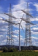 Two overhead line pylons and a wind turbine, Witten, Ruhr area, North Rhine-Westphalia, Germany,