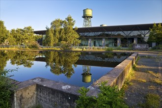 The water tower with the Jahrhunderthalle in Westpark, industrial heritage, Bochum, Ruhr area,