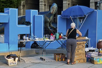 Plateosaurus model with flea market at the Bochum sign on the town hall square, Dino City III,